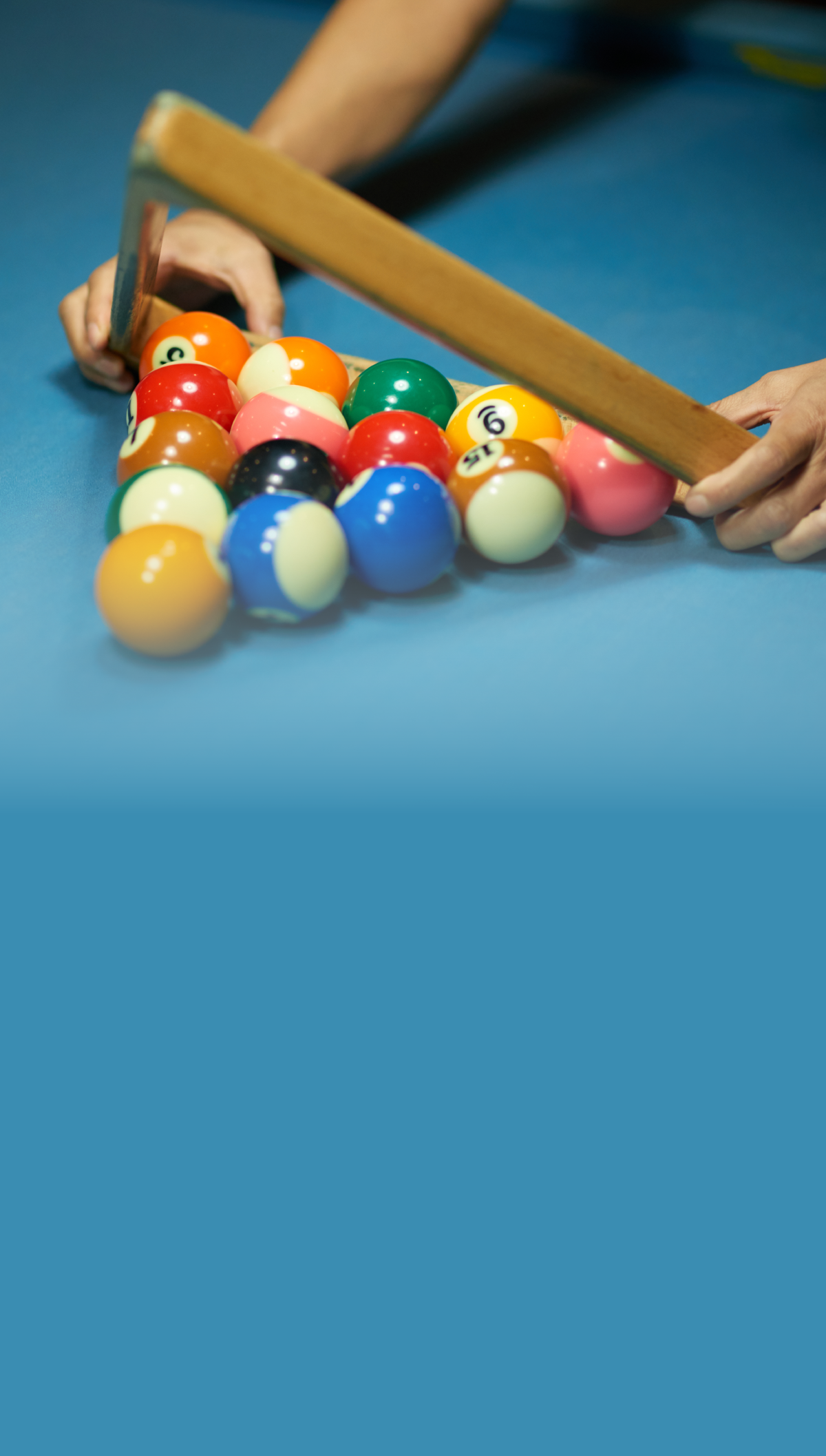 Custom billiards jerseys and pool team apparel for pool leagues like APA, USA, and BCA teams, shown with racked pool balls on a billiards table